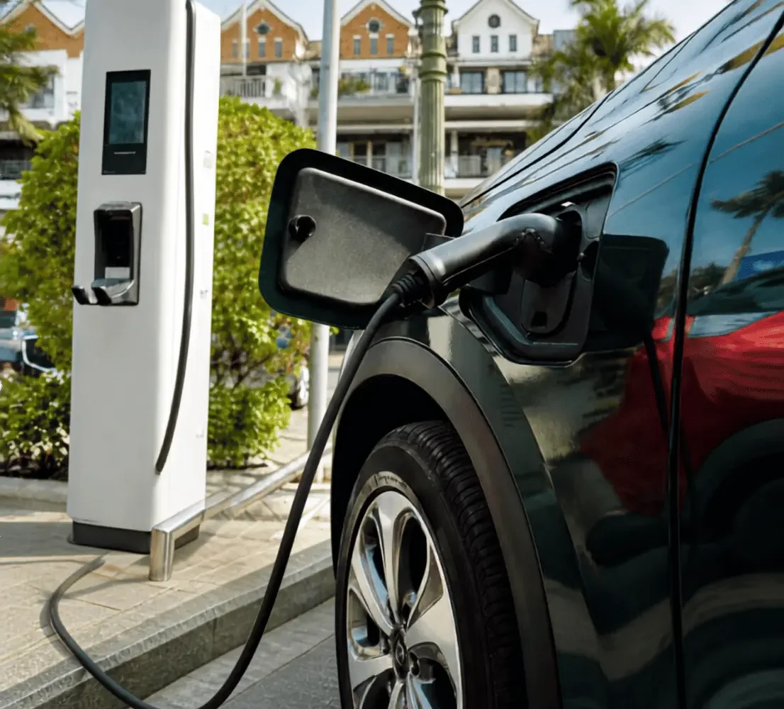Electric vehicle plugged into a public EV charging station